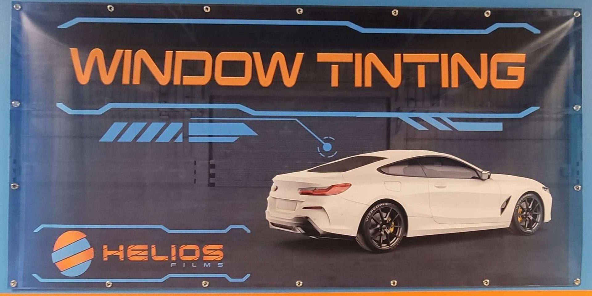 Helios Films Banner 1 Helios Films Window Tinting Banner showcasing bold branding.