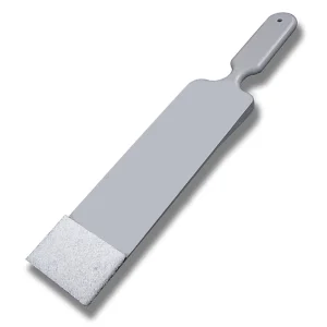 The Scrubber with a long handle and replaceable white scrub pad, designed for cleaning hard-to-reach areas.